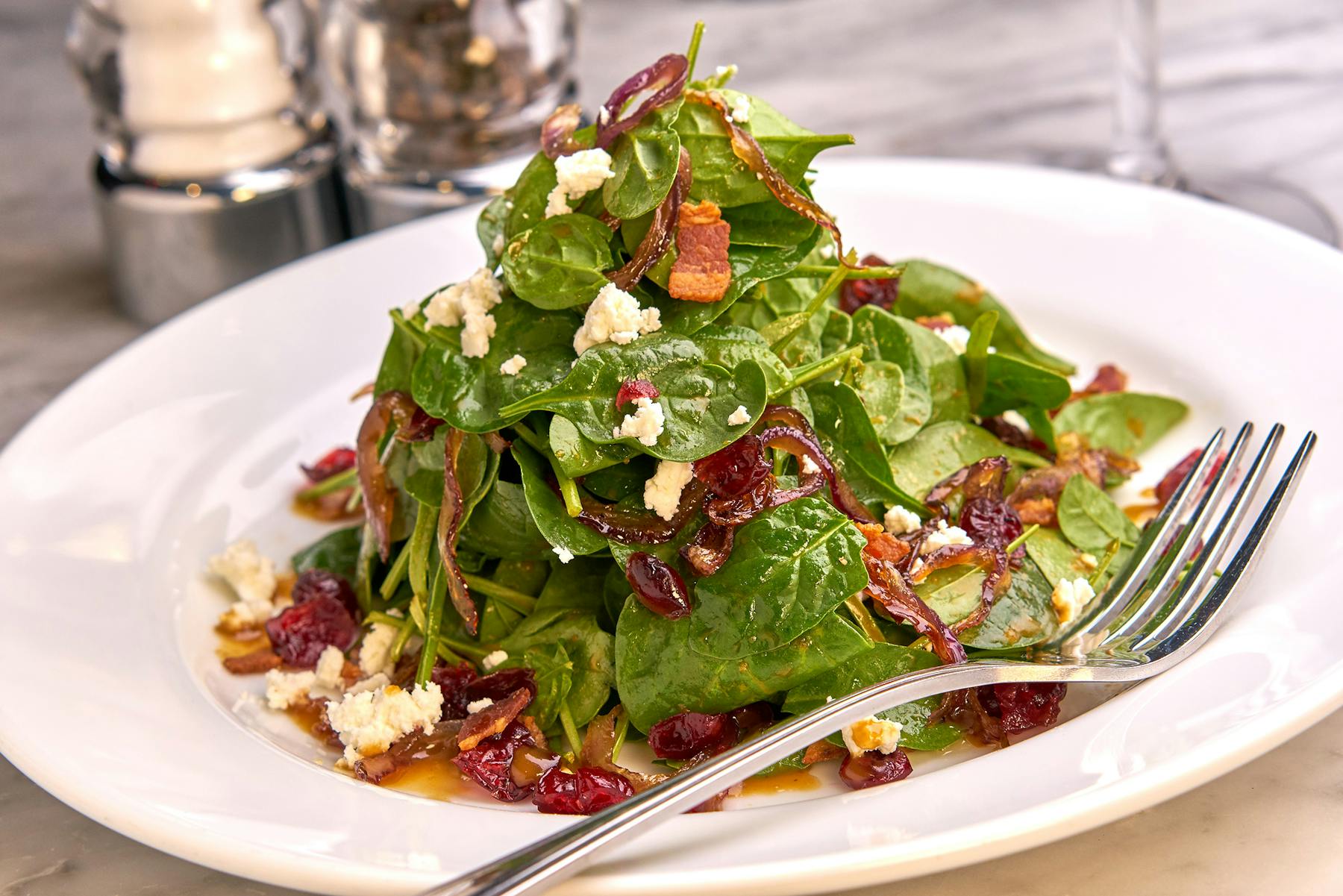 a white plate topped with a salad